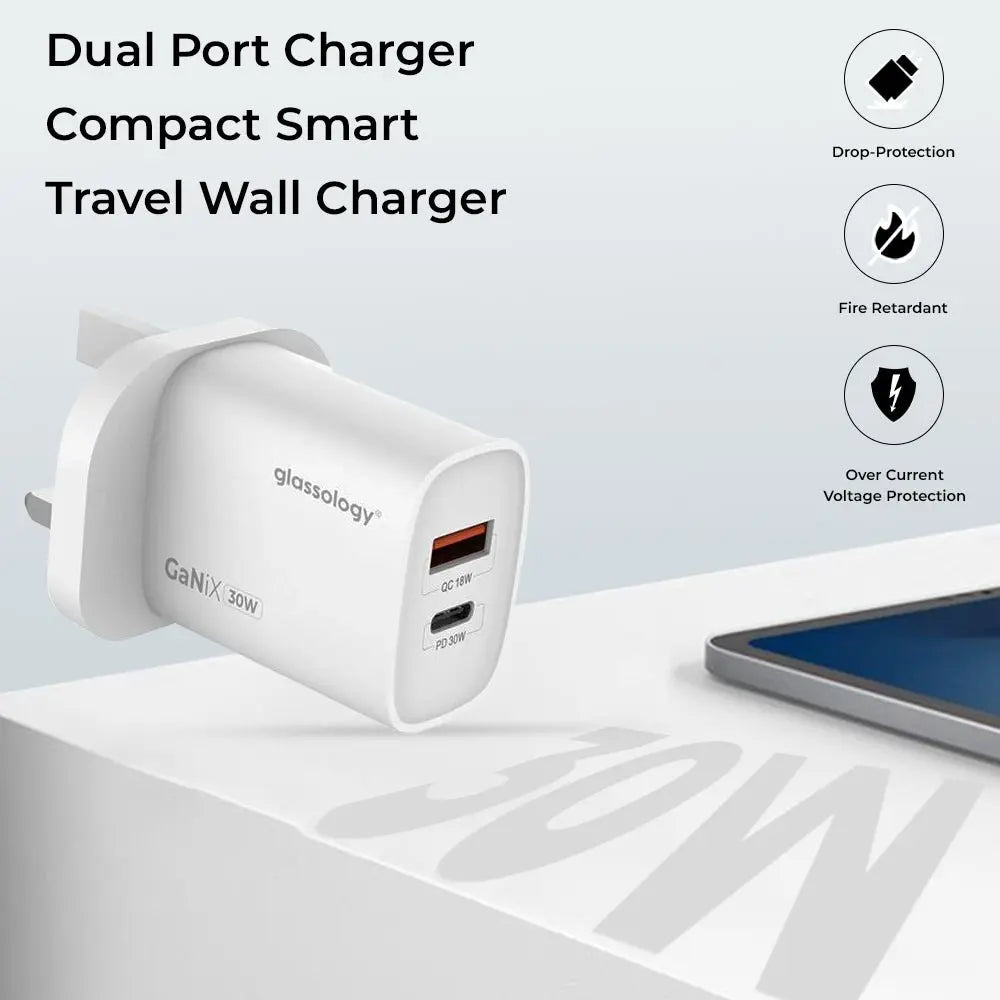 Glassology dual port charger with smartphone on a white surface