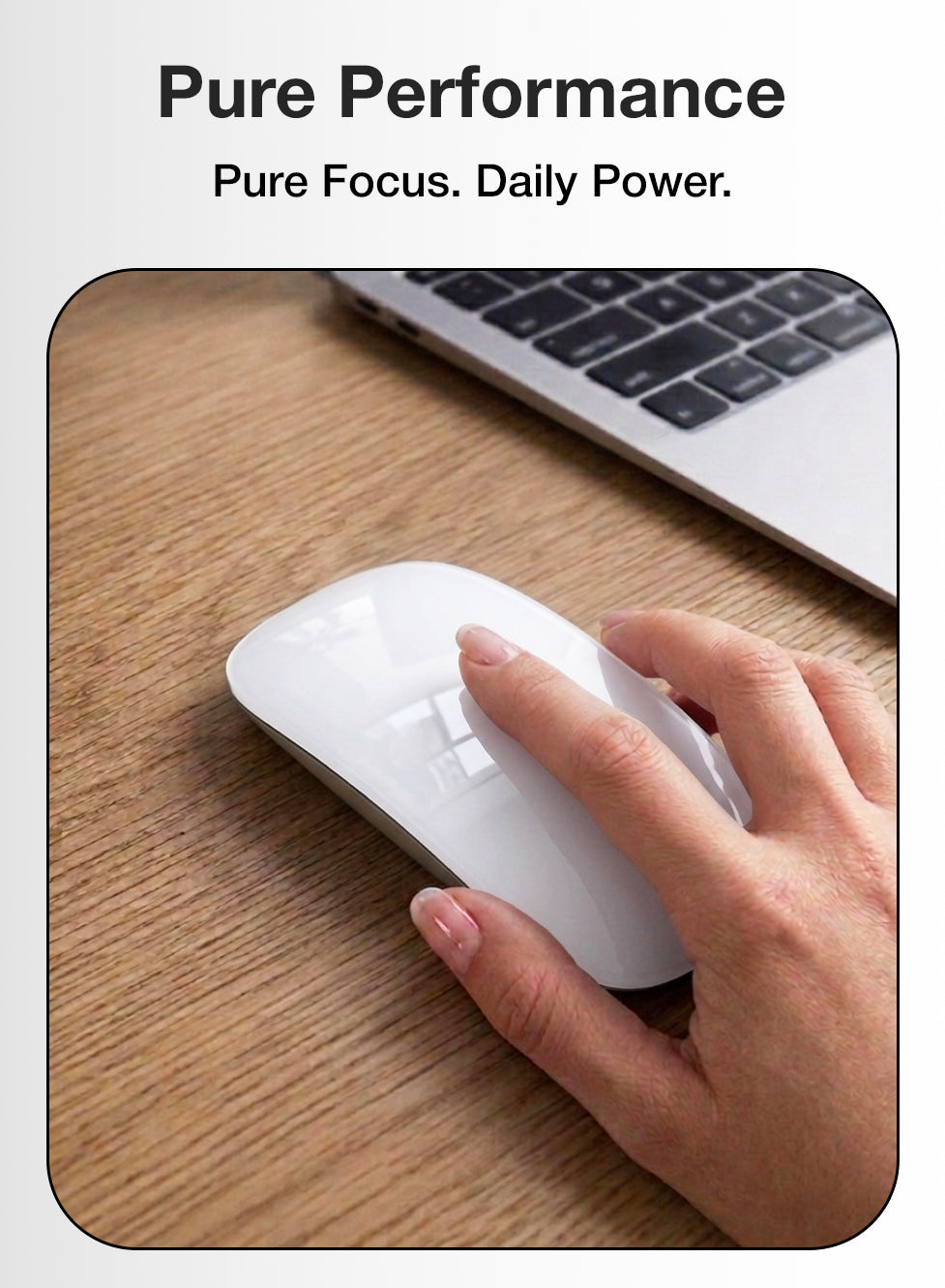 Hand using a white computer mouse on a wooden desk with a laptop in the background, featuring the text 'Pure Performance' and 'Pure Focus. Daily Power.